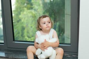 Little girl with teddy bear photo