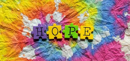 hope word on colorful tie dye background photo