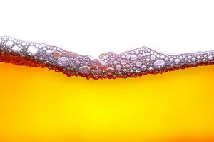 beautiful yellow-orange water waves and also beautiful bubbles, white background photo