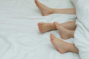 a couple of feet under a white sheet photo