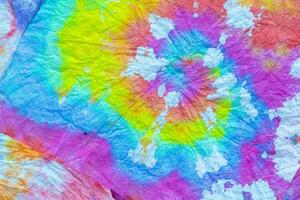 a tie dye fabric with a colorful swirl photo