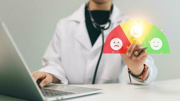 Healthcare and medical concept. Doctor using laptop computer with scale for clients feedback symbol. photo