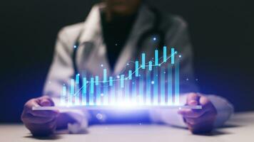 Close up of female doctor holding tablet with glowing forex chart on screen photo