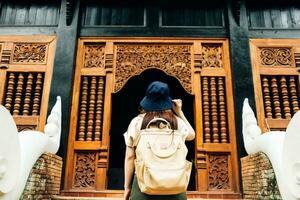 Asian traveller take a photo to Pagoda of wat lok moli temple in Chiang mai city, Thailand