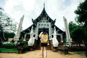 Asian traveller take a photo to Pagoda of wat lok moli temple in Chiang mai city, Thailand