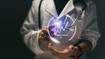 Close up of female doctor holding stethoscope and cardiogram photo