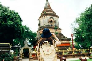 Asian traveller take a photo to Pagoda of wat lok moli temple in Chiang mai city, Thailand