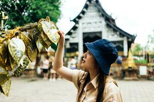 Asian traveller take a photo to Pagoda of wat lok moli temple in Chiang mai city, Thailand