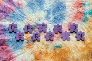 Depression - the word is spelled out in colorful pieces of puzzle stock photo