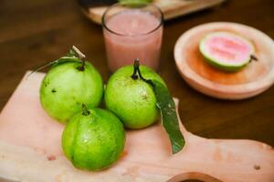 Flat lay of half cut fresh guava on the table photo