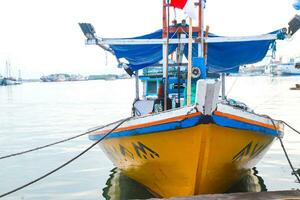 The hustle and bustle in the morning at traditional ports when loading and unloading goods and passengers photo