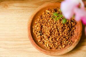 Tempe orak arik or scrambled tempeh served on a wooden plate photo