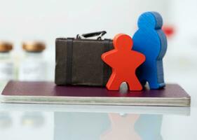 a wooden figurine of a man and woman photo