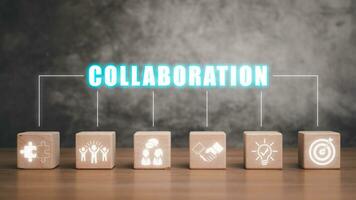 Collaboration concept, Wooden block on desk with collaboration icon on virtual screen photo