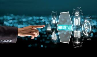 Industry 4.0 concept, Person hand touching Industry 4.0 icon on virtual screen with blue bokeh background. photo