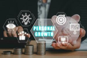 Personal growth concept, Business person hand holding piggybank and using calculator on desk with personal growth icon on virtual screen. photo