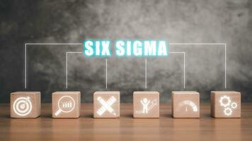 Six sigma concept, Wooden block on desk with six sigma icon on virtual screen. photo