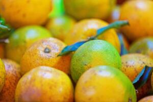 Stack of oranges on a market stall photo