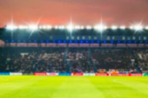 Blurry de-focused stadium football  twilight background. photo