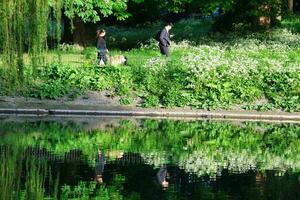 Beautiful Low Angle View of People are Enjoying the Starting of Summer at Wardown Public Park of Luton Town of England UK. The Footage Was Captured on Beautiful Day of April 22rd, 2023 photo