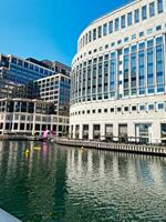 Low Angle View of Canary Wharf Buildings at Central London City of England Great Britain. The Footage Was Captured on June 8th, 2023 During Clear Sunny Day. High Resolution 64 Mega Pixels Image photo