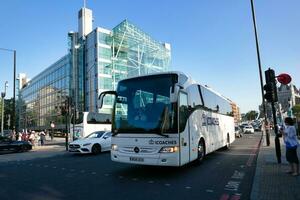 Gorgeous Low Angle view of Bus Service and British Traffic at London Bridge Which is Most Famous and Historical Bridge over River Thames at Central London City of England UK. June 4th, 2023 photo