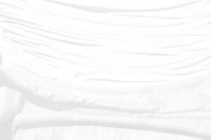 Top view Abstract White cloth background with soft waves.Wave and curve overlapping with different shadow of color,white fabric, crumpled fabric. photo