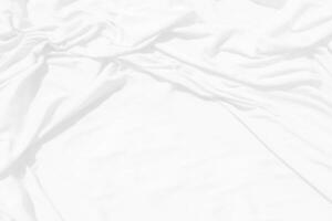 Top view Abstract White cloth background with soft waves.Wave and curve overlapping with different shadow of color,white fabric, crumpled fabric. photo