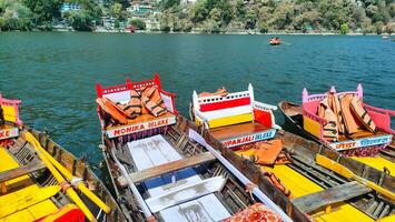 boats on lake dhaulagiri, manali, india photo