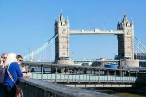 Most Beautiful Image of International Community Tourist People are Visiting Tower Bridge and River Thames at Central London Capital City of England Great Britain UK on Sunny Day of June 4th, 2023 photo