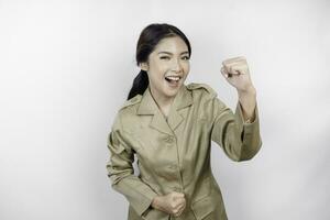 Beautiful Asian woman wearing uniform feeling enthusiast. Success concept of Indonesian government employees photo