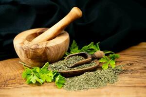 Fresh green parsley or dried and rubbed parsley Petroselinum crispum photo