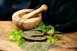 Fresh green parsley or dried and rubbed parsley Petroselinum crispum photo