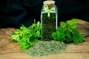 Fresh green parsley or dried and rubbed parsley Petroselinum crispum photo