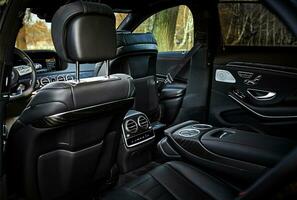 Modern car black leather interior background,  inside luxury city car photo