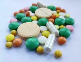 Colourful pills set, medicine background photo
