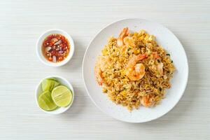 fried shrimps fried rice on plate photo