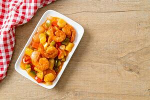 Stir-fried sweet and sour with fried shrimp photo