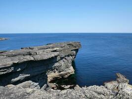 Cliffs and Atlantic ocean, rocks canyon and laguna, beauty in nature. Vacation travel background photo