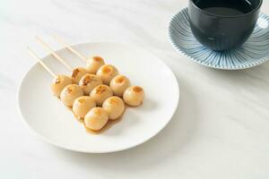 Mitarashi dango. Dumpling in a sweet soy sauce photo