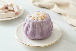 taro bun with white sugar cream and nut photo