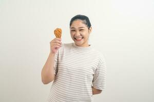 Asian woman with fried chicken on hand photo