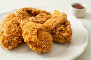 fried chicken with ketchup on plate photo