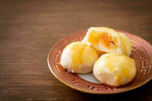 Chinese pastry moon cake with salted egg peanut or Spring Roll pastry with nuts and salted eggs photo