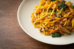 stir-fried yakisoba noodles with vegetable in vegan style photo