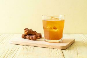 Delicious sweet drink tamarind juice and ice cube photo