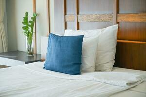 comfortable pillows and white pillows on bed photo