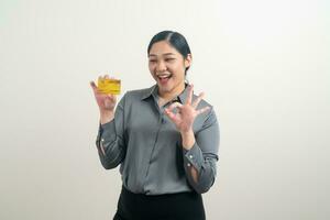 Asian woman holding credit card with white background photo