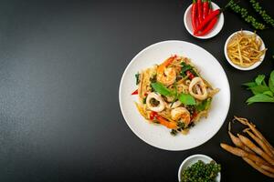 stir fried spicy noodles with sea food photo