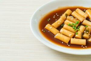 Spicy Jjajang Tteokbokki or Korean rice cake in spicy black bean sauce photo